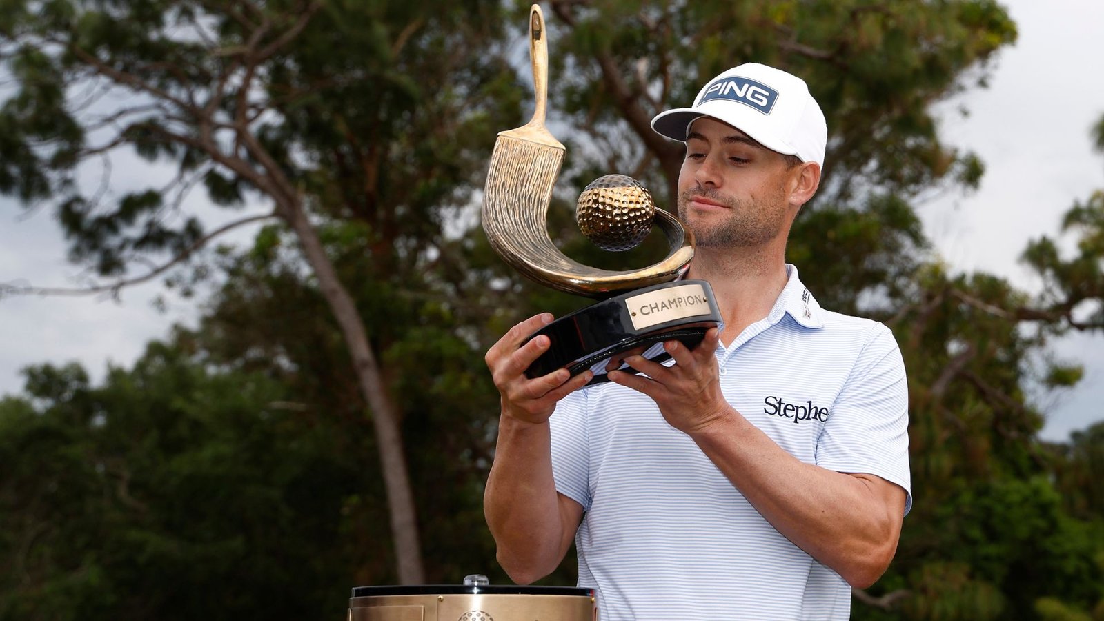 Taylor Moore with Valspar trophy